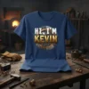 Navy blue t-shirt with "HI, I'M KEVIN" text in white and gold, set within a circular gear and rivet design