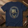 Navy t-shirt featuring the text "Hi." inside a gold and silver Celtic knot border with a deer graphic below