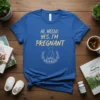 Blue t-shirt with "HI. HELLO. YES, I'M PREGNANT" in gold lettering and a pregnant silhouette in a floral wreath