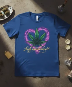 High Maintenance text with a green cannabis leaf inside a pink glowing heart on a blue t-shirt