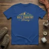 Royal blue t-shirt with "HILL COUNTRY Strong" text and mountain graphic, perfect for outdoor enthusiasts