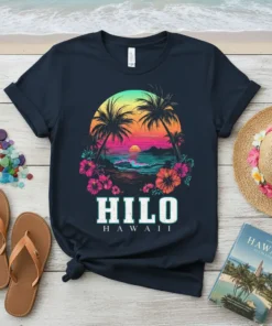 Hilo Hawaii text with tropical sunset, palm trees, and hibiscus flowers graphic on a navy t-shirt