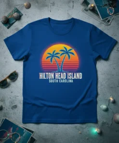 Hilton Head Island South Carolina text with palm trees and retro sunset graphic on a blue t-shirt