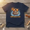 HIPPO BEACH CLUB text on a navy t-shirt featuring a cartoon hippo wearing sunglasses in water with a sun graphic