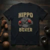 Hippo Boxer T-Shirt featuring a muscular cartoon hippo wearing boxing gloves and the text "HIPPO BOXER"
