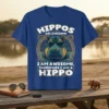 Blue t-shirt design with text "Hippos Are Awesome I Am Awesome, Therefore I Am A Hippo" and a cool hippo