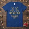 Royal blue t-shirt with "Ho Ho Ho" text in glittery gold, flanked by two ornate reindeer and a holly bow