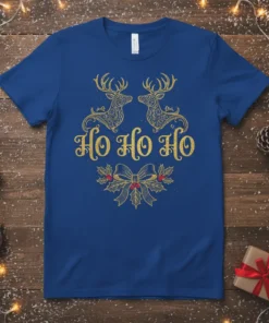 Royal blue t-shirt with "Ho Ho Ho" text in glittery gold, flanked by two ornate reindeer and a holly bow