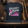 Hockey Hair Don't Care text with hockey helmet and braided hair graphic on a dark t-shirt