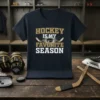 Hockey Is My Favorite Season text design with crossed hockey sticks and puck on a dark t-shirt