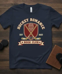 Hockey Romance Book Club Est 2023 t-shirt with hockey sticks, mask, and puck graphic