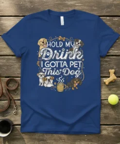T-shirt featuring the quote "HOLD MY Drink I GOTTA PET This Dog" surrounded by various cute dog illustrations and a