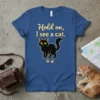 Black cat graphic t-shirt with text "Hold on, I see a cat." and paw prints