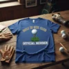 Blue t-shirt with "Hole in One Club Official Member" text and a golf ball on a tee graphic
