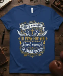 T-shirt with "Holy Enough To Pray For You Hood Enough To Swing On You" text and cross graphic
