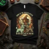 Home of the Wicked Witch and Her Pack of Dogs t-shirt design featuring a witch and four dogs under a
