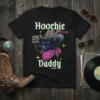 Hoochie Daddy Meow Kitty Kitty Cowboy Cat T-Shirt with a black cat wearing a cowboy hat and bandana