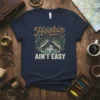 Hookin' Ain't Easy t-shirt with bass fish graphic and water waves