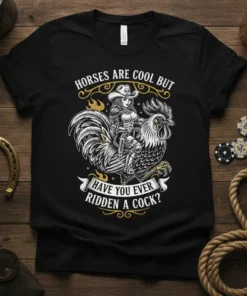 T-shirt design featuring the text "HORSES ARE COOL BUT HAVE YOU EVER RIDDEN A COCK?" with a cowboy riding a