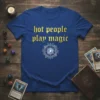 Blue t-shirt with gold text "hot people play magic" and a white magical symbol graphic