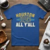 Blue t-shirt with "Houston All Y'all" text and an armadillo graphic, celebrating Houston, Texas pride