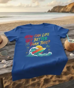 Blue t-shirt with colorful text "How Can Life Get Better Than This?" above a surf wave, surfboard, palm trees, and