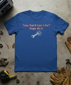 T-shirt with the quote "how hard can it be? boys do it." and a wrench with gear graphic