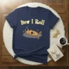 Navy blue t-shirt with yellow text "How I Roll" and a cartoon brown dog rolling on its back