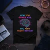 Black t-shirt with neon text "HOW YOU GONNA WIN, YOU AIN'T RIGHT WITHIN?" and a circuit board brain graphic