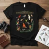T-shirt with "How To Identify A Bird" text and colorful illustrations of various bird species, perfect for bird watching enthusiasts