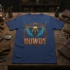 HOWDY text with a golden bull skull and turquoise smoke design on a navy blue t-shirt