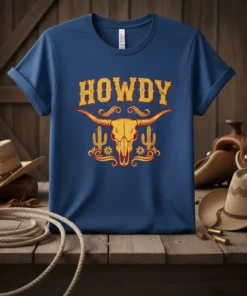 Blue t-shirt with yellow and red "HOWDY" text and a steer skull with cactus graphic