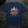 HU HUSTLE 24.7.365 text with city skyline graphic on a navy t-shirt
