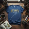 Hudson New York t-shirt with a decorative gold font and a white river graphic