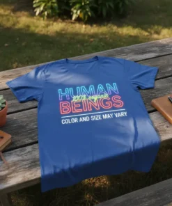 Blue t-shirt with neon-style text "HUMAN 100% organic BEINGS COLOR AND SIZE MAY VARY" graphic