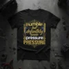 Black t-shirt with gold and blue text reading "humble but definitely some pressure PRESSURE" in a tech-inspired design