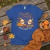 Humpty Dumpty Had A Great Fall T-Shirt featuring cartoon eggs, pumpkins, and autumn leaves with orange text