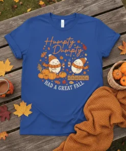 Humpty Dumpty Had A Great Fall T-Shirt featuring cartoon eggs, pumpkins, and autumn leaves with orange text