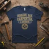 Navy blue t-shirt with "Husband. Dad. Carpenter. Legend." in gold distressed text and a gear graphic with crossed hammers
