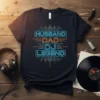 Husband Dad DJ Legend text in neon blue and orange on a black t-shirt, featuring circuit board design elements