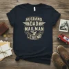 Husband Dad Mailman Legend text design with wings and eagle graphic on a navy t-shirt
