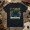 Black t-shirt with "Hyperbole" definition design, featuring ornate scrollwork and griffins, highlighting "The most amazing and extraordinary word in the