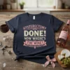 Hysterectomy Done! Now Where's The Wine? text design with pink and yellow vintage-style lettering on a navy blue t-shirt