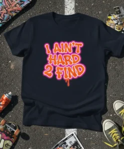 I Ain't Hard 2 Find bold orange and pink graffiti-style text on a black t-shirt