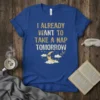 I Already Want To Take A Nap Tomorrow quote on a blue t-shirt with a sleepy moon graphic and clouds