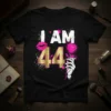 I AM 44 birthday t-shirt with pink lips, gold number 44, and a skeleton hand holding a pink rose