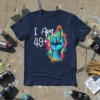 I Am 49+ birthday t-shirt with a vibrant blue hand giving the middle finger, surrounded by colorful paint splatters