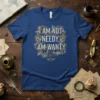 I AM NOT NEEDY. AM WANTY. quote on a blue t-shirt with ornate floral and heart design, vintage style