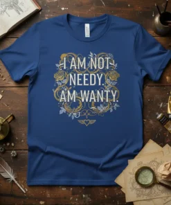 I AM NOT NEEDY. AM WANTY. quote on a blue t-shirt with ornate floral and heart design, vintage style