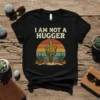 I Am Not A Hugger t-shirt with a green cactus and retro desert sunset graphic